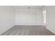 Neutral bedroom with carpet and paint and open doorway at 3634 Moscato Dr, Brooksville, FL 34602