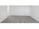 Neutral bedroom with wall-to-wall carpeting and a door offering seamless transitions at 3634 Moscato Dr, Brooksville, FL 34602