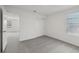 Neutral-toned room with carpet, a window and an entrance to another room at 3634 Moscato Dr, Brooksville, FL 34602