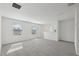 Upstairs bonus room with carpet, neutral walls, two windows and natural light at 3634 Moscato Dr, Brooksville, FL 34602