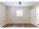 Bedroom with wood-look floors, ceiling fan, and window at 777 27Th S Ave, St Petersburg, FL 33705