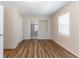 Bedroom with closet, wood-look floors, and ensuite bathroom access at 777 27Th S Ave, St Petersburg, FL 33705