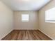 Bedroom with wood-look floors and natural light from windows at 777 27Th S Ave, St Petersburg, FL 33705