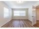 Neutral bedroom with wood-look floors and natural light from windows at 777 27Th S Ave, St Petersburg, FL 33705