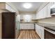 Modern kitchen with stainless steel appliances, granite countertops, and white cabinets, perfect for cooking at 777 27Th S Ave, St Petersburg, FL 33705
