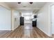Spacious room with new floors opening into a modern kitchen; perfect for entertaining guests at 777 27Th S Ave, St Petersburg, FL 33705