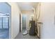The home's utility room with water heater and access to the garage and other rooms at 777 27Th S Ave, St Petersburg, FL 33705
