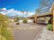 Spacious backyard with gravel, mature palm trees, and a covered area for outdoor relaxation at 8135 33Rd Ave N, St Petersburg, FL 33710