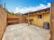 Backyard concrete slab with a wooden structure and partial fencing at 8135 33Rd Ave N, St Petersburg, FL 33710