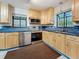 Updated kitchen featuring stainless steel appliances, light-colored cabinets, and tiled backsplash at 8135 33Rd Ave N, St Petersburg, FL 33710