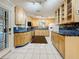 Bright kitchen featuring stainless steel appliances, light-colored cabinets, and tiled backsplash at 8135 33Rd Ave N, St Petersburg, FL 33710