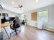 Comfortable living room with wood floors, ceiling fan, and lots of natural light at 8135 33Rd Ave N, St Petersburg, FL 33710
