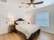 Cozy bedroom with a ceiling fan, plush bed, and bright window, creating a comfortable atmosphere at 8539 Sandpiper Ridge Ave, Tampa, FL 33647