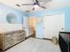 Serene Bedroom with light blue walls, neutral accents, and ample storage, creating a calming environment at 8539 Sandpiper Ridge Ave, Tampa, FL 33647