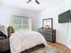 Cozy bedroom with a comfortable bed, stylish decor, and natural light from the window at 8539 Sandpiper Ridge Ave, Tampa, FL 33647