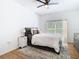 Inviting bedroom featuring a comfortable bed, a cozy rug, and soft natural lighting at 8539 Sandpiper Ridge Ave, Tampa, FL 33647