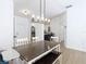 This is the dining room area that features a view into the kitchen and the front door at 8539 Sandpiper Ridge Ave, Tampa, FL 33647