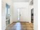 Bright foyer with tile flooring, arched doorway, and convenient access to a half-bathroom at 8539 Sandpiper Ridge Ave, Tampa, FL 33647
