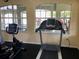 The gym is filled with exercise equipment and also has great lighting at 8539 Sandpiper Ridge Ave, Tampa, FL 33647