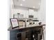 Bright kitchen featuring stainless steel appliances, white cabinets, and a breakfast bar at 8539 Sandpiper Ridge Ave, Tampa, FL 33647