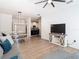 Open-concept living room with light wood floors, dining area, and modern decor for comfortable living at 8539 Sandpiper Ridge Ave, Tampa, FL 33647