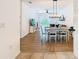 Open-concept dining and living area featuring wood floors and neutral decor at 8539 Sandpiper Ridge Ave, Tampa, FL 33647