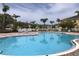 Community pool area with ample seating for residents to relax at 8539 Sandpiper Ridge Ave, Tampa, FL 33647