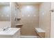 Updated bathroom featuring a tiled shower with a built-in bench and neutral colored walls at 10151 114Th N Ter, Largo, FL 33773