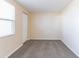 Cozy bedroom featuring neutral carpet, a window with blinds, and a closet at 10151 114Th N Ter, Largo, FL 33773