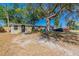 Inviting single-story home showcasing mature trees and a neatly kept lawn in a desirable location at 10151 114Th N Ter, Largo, FL 33773