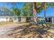 Charming single-story home featuring a well-maintained lawn and mature trees offering ample shade at 10151 114Th N Ter, Largo, FL 33773