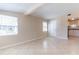 Bright living room with tile flooring, large windows and access to kitchen at 10151 114Th N Ter, Largo, FL 33773