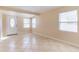 Bright living room with tile flooring and natural light from the front door and windows at 10151 114Th N Ter, Largo, FL 33773