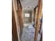 Bathroom under renovation with new tile flooring, a bathtub, and a toilet at 1810 New Hampshire Ne Ave, St Petersburg, FL 33703