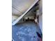 Damaged garage featuring a broken door and ample space for storage or projects at 1810 New Hampshire Ne Ave, St Petersburg, FL 33703