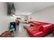 Eclectic living room featuring unique furniture, tiled floors, and ample natural light at 1810 New Hampshire Ne Ave, St Petersburg, FL 33703