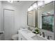 Bright bathroom has a double vanity and a tiled shower with a built-in skylight for natural light at 18526 Sweetbay Ln, Dade City, FL 33523