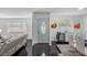 Stylish entryway showcasing a modern door, dark floors, and bright, neutral decor at 18526 Sweetbay Ln, Dade City, FL 33523