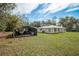 The home has an additional carport for parking and storage at 18526 Sweetbay Ln, Dade City, FL 33523
