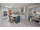Spacious kitchen with an island, stainless steel appliances, and open layout to dining area at 18526 Sweetbay Ln, Dade City, FL 33523