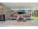 Well-appointed outdoor bar with modern appliances, custom shelving, and beautiful backyard views at 18526 Sweetbay Ln, Dade City, FL 33523