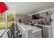 Outdoor bar featuring a sleek countertop, stainless steel amenities, and comfortable seating nearby at 18526 Sweetbay Ln, Dade City, FL 33523