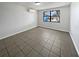 Bright bedroom with tile flooring and a large window offering natural light and views at 3409 King Richard Ct, Seffner, FL 33584