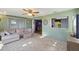 Comfortable living room with an open layout, seamlessly connecting to the kitchen and dining area at 7801 Cherrytree Ln, New Port Richey, FL 34653