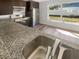 Modern kitchen with granite countertops, stainless steel appliances, and hardwood floors at 2052 Sheffield Ct, Oldsmar, FL 34677