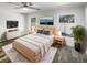 Cozy main bedroom with soft natural light, neutral tones, stylish furniture, and a ceiling fan at 2052 Sheffield Ct, Oldsmar, FL 34677