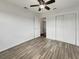 Cozy bedroom with wood-look flooring and closet with sliding doors at 507 Chevy Chase Dr, Sarasota, FL 34243