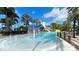 Resort-style community pool with a splash pad, lighthouse, and plenty of seating at 1011 Signet, Apollo Beach, FL 33572