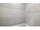 Walk-in closet offers ample storage space with built-in wire shelving and neutral walls at 24299 Kingsway Cir, Punta Gorda, FL 33983