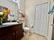 Bathroom with vanity sink, dark countertop, closet and tiled flooring at 724 Parker Den Dr, Ruskin, FL 33570